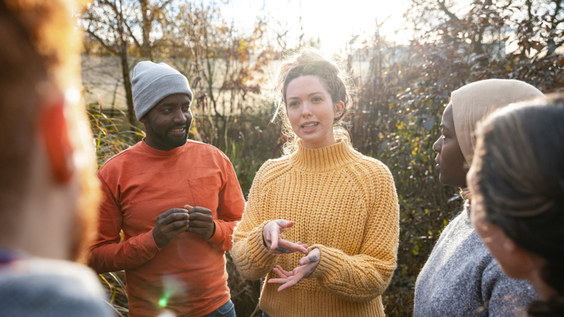 Community group talking in a garden