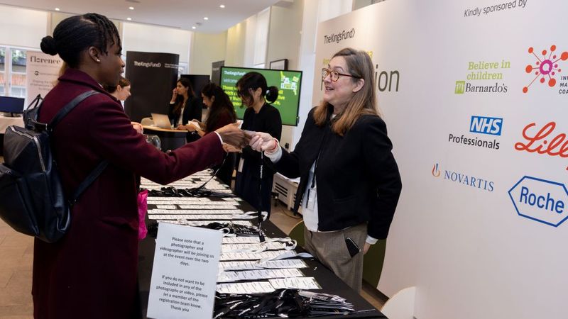 Lady registering at the annual conference