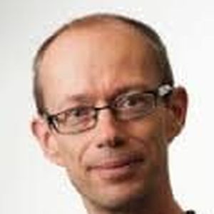 A headshot of Mathew Thomson