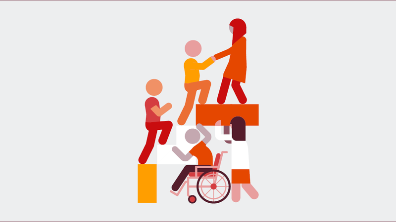 People helping each other up a set of stairs.