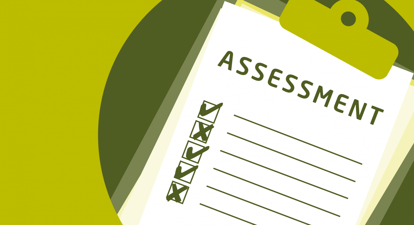 Clipboard with the word 'assessment' on it