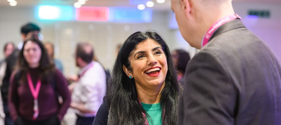 Delegates chatting to each other at a conference