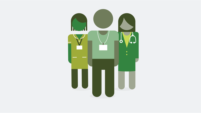 Three health care workers standing together