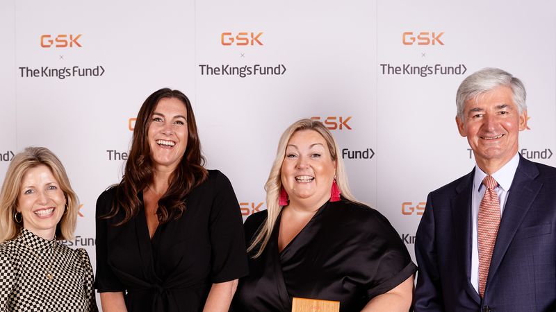 Staff from Ivison Trust with their award, along with Sarah Woolnough, The King's Fund Chief Executive, and Sir Jon Symonds from GSK