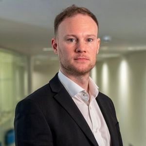 Headshot of Dr Adam P Januszewski