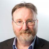 A headshot of Mark Doughty