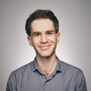 A headshot of Mark Dayan