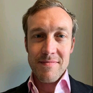 A headshot of Thomas Johnson, Head of Reform, Strategy and Policy, Greater Manchester Combined Authority and Deputy SRO for the Prevention Demonstrato