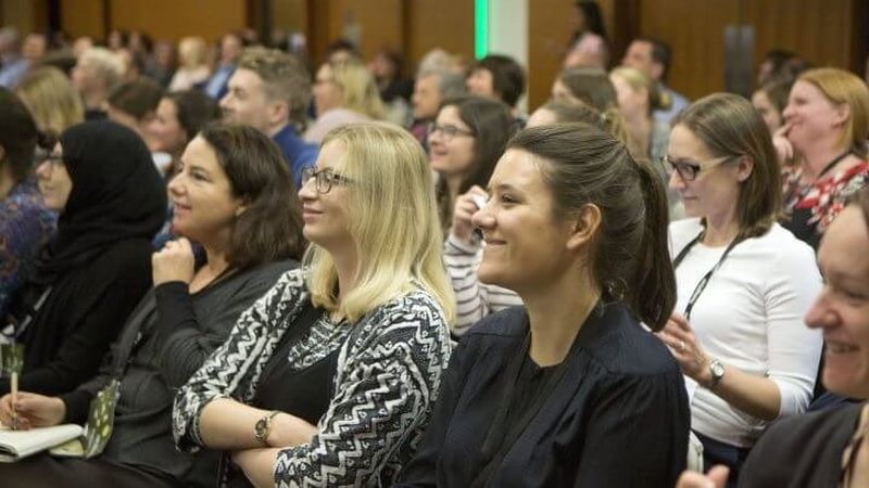 Smiling audience at The King's Fund