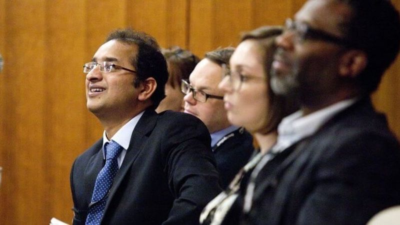 Audience member asking a question at a conference